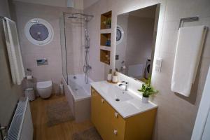 a bathroom with a sink and a shower and a toilet at Marant Luxury Apartment in Agios Rokkos +48 photos