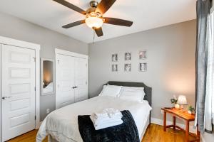 a bedroom with a bed and a ceiling fan at Modern Nashville Condo Walk to Local Breweries! in Nashville