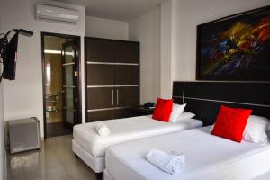 Postel nebo postele na pokoji v ubytování Hotel Or Cartagena + 16 fotografií