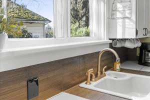 a kitchen with a sink and a window at C Street Charm in Coeur d'Alene +41 photos