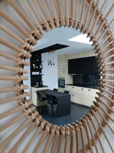 a kitchen with a table and a dining room at Le Studio in La Louvière