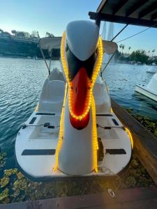 a white boat with a duck face on the water at Sunset Dream Cottage in Los Angeles