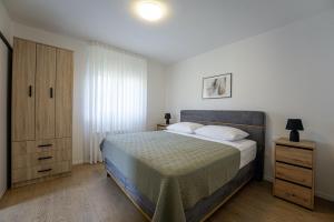 Postel nebo postele na pokoji v ubytování Villa Tina in Pinezići (Haus für 10 Personen)