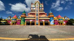 a large building with a clock tower on it at ITA506T1 Beto Carrero e Praia ótima localização! in Piçarras