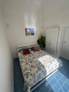Postel nebo postele na pokoji v ubytování SUITE 21 ERCOLANO