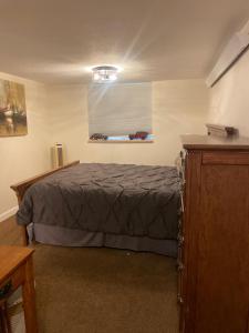 a bedroom with a bed and a window at Del Boca Vista in Owatonna