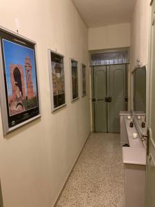 a bathroom with a large picture of a tower on the wall at il nuvoloso 2 in Città della Pieve