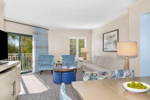 a living room with a couch and a table at Marriott's Barony Beach Club in Hilton Head Island