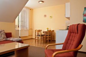 Posezení v ubytování Apartmány Šumava + 11 fotografií
