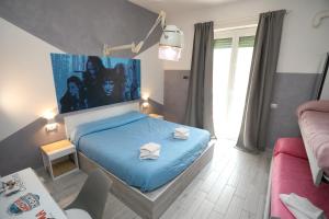 Posteľ alebo postele v izbe v ubytovaní Cineroma Guesthouse