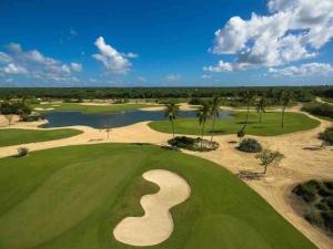 an aerial view of the golf course at the resort at Gourgeous 2 bedroom Beach Apt Playa Nueva Romana in San Pedro de Macorís