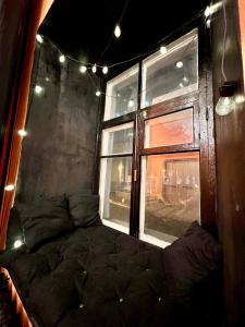 a large bed in a room with a window at KyivHome Loft on Maidan Independence Square in Kyiv