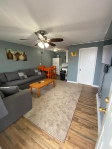 a living room with a couch and a table at 23 B ST APARTMENTS in Hampton