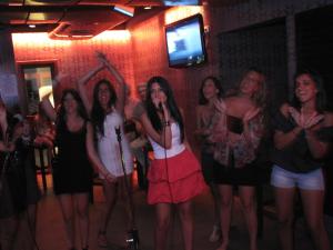 a group of women singing at a party at Camel Dive Club & Hotel - Boutique Hotel in Sharm El Sheikh