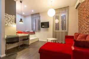 Televízia a/alebo spoločenská miestnosť v ubytovaní Apartments Aspalathos