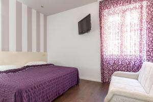 Postel nebo postele na pokoji v ubytování Apartments Aspalathos