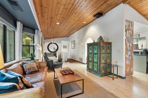 a living room with a couch and a table at Camp Ciyole in Guerneville