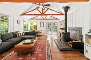 a living room with a couch and a fireplace at Caz-A-Verde in Cazadero