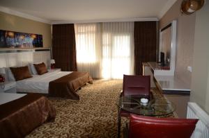 Postel nebo postele na pokoji v ubytování Atamer Doga Resort + 37 fotografií