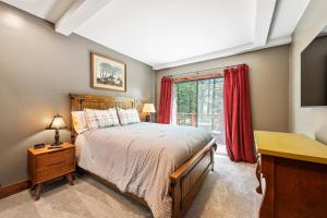 a bedroom with a bed and a window at Morningwood in Guerneville