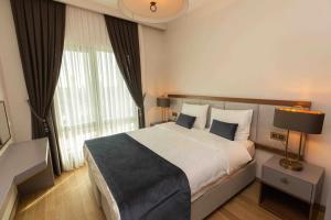 Säng eller sängar i ett rum på Luxurious Residence in Istanbul