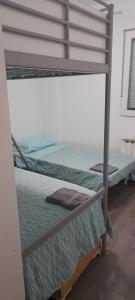 a pair of bunk beds in a room at Casa francisca in Arroyo de la Encomienda