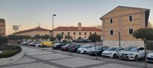 a bunch of cars parked in a parking lot at Casa francisca in Arroyo de la Encomienda