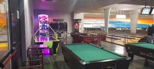 a room with a pool table and bowling lanes at Casa francisca in Arroyo de la Encomienda