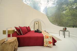 a bedroom with a bed in a tent with a window at TERRAMAGA glamping in San Francisco