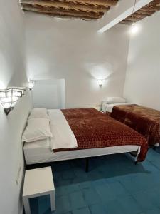 Postel nebo postele na pokoji v ubytování Hotel Riad Sahara Activity