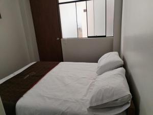 Un pat sau paturi într-o cameră la VEGA HOME