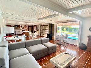 a living room with a couch and a table at Vinha da Quinta in Sintra