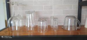 a group of glass vases sitting on a table at Moon 4 in Puerto Morelos