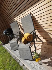 two chairs with a teddy bear sitting on them at Minidomeček Páteček in Klatovy