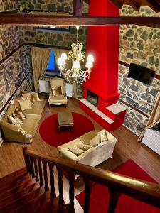 an overhead view of a living room with a chandelier at Gioras Hotel in Palaios Agios Athanasios