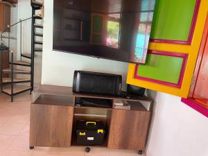 a tv on top of a entertainment center at La victoria in Marsella