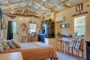 a bedroom with a bed and a kitchen in a cabin at Eagles Nest Studio in Rising Fawn Creek Access in Rising Fawn