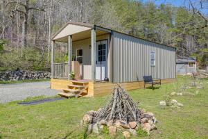 a small shed with a porch and a bench at Eagles Nest Studio in Rising Fawn Creek Access in Rising Fawn