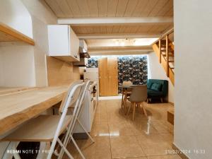 a kitchen and dining room with a table and chairs at Alle volte Suite 30 in Grumo Appula +31 photos
