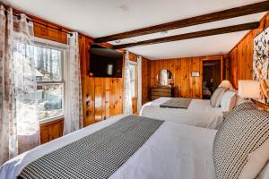 a bedroom with two beds and a window at Inviting Alton Bay Home Near Lake Winnipesaukee! in Alton Bay