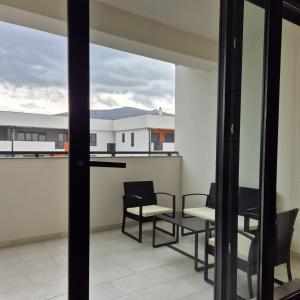 a balcony with a table and chairs and a view at Apartman Nocturno Trebinje in Trebinje