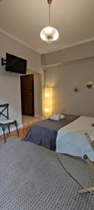 Posteľ alebo postele v izbe v ubytovaní Myron,Athens - COZY & KING-SIZE BED