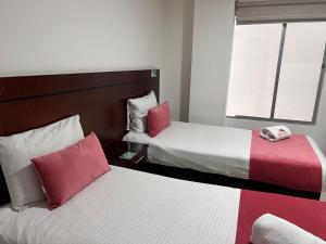 Postel nebo postele na pokoji v ubytování Hotel Dorado Gold