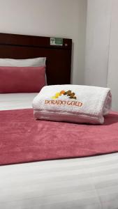 Postel nebo postele na pokoji v ubytování Hotel Dorado Gold
