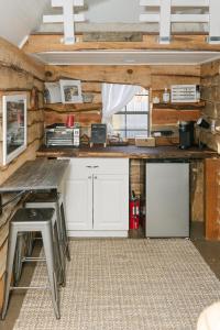 a kitchen with white cabinets and a counter top at Blythe Shoals Base Camp in Cleveland