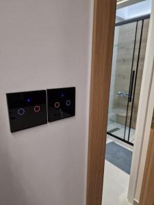 a pair of speakers on a wall next to a door at Patras Blue Sea and Sky Deluxe Apartment in Patra