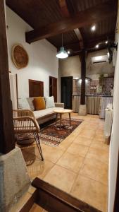 a living room with a couch and a table at Las cuevas del agua in Chinchón