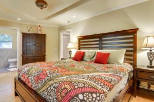 a bedroom with a large bed with red pillows at Bonne Chere in Guerneville
