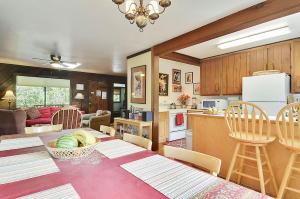 a kitchen and living room with a table and chairs at The Boat House in Guerneville