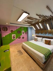 a bedroom with a large bed in a room at Coco Beach Hotel - Rooftop & Beach Club in Cartagena de Indias